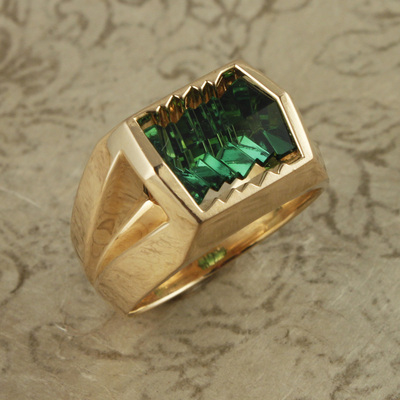 18 Karat Yellow Gold ring with a carved Green Tourmaline in the center.