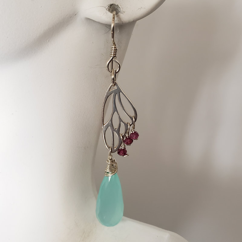 Sterling Silver French Wire butterfly wing shaped earrings with a faceted briolette Aqua Chalcedony drop and small round Rhodolite Garnets.