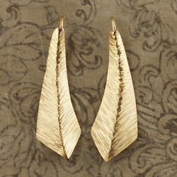 18 Karat Yellow Gold post earrings in the shape of tapering leaves.