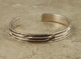 Sterling Silver cuff bracelet with grooves. 