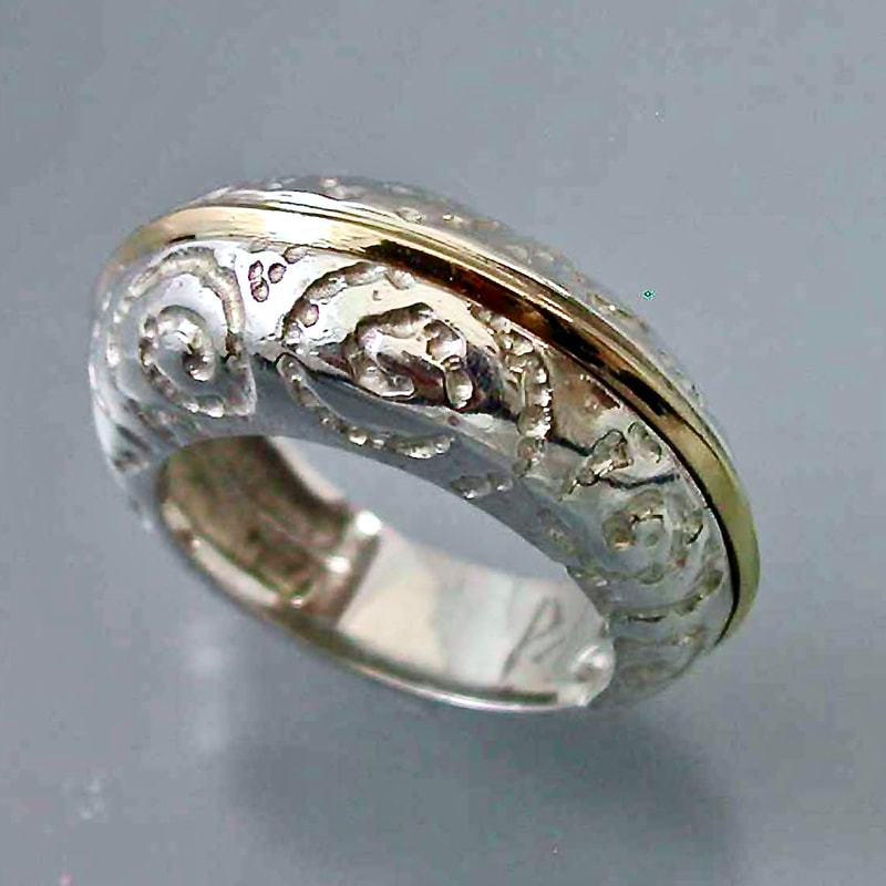 Silver carved domed band with a strip across the top of Gold.