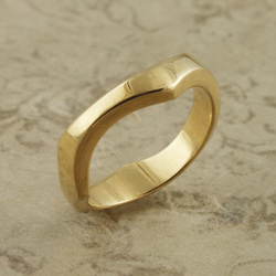 18 Karat Yellow Gold wavy ring.