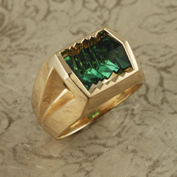 18 Karat Yellow Gold ring with a carved Green Tourmaline in the center.