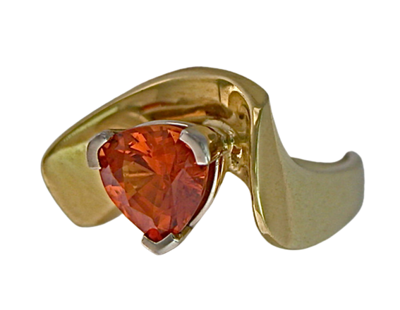 18 Karat Yellow Gold ring with a Trillion shaped Spessartite Garnet.