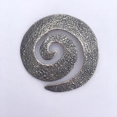 Sterling Silver spiral textured pin.