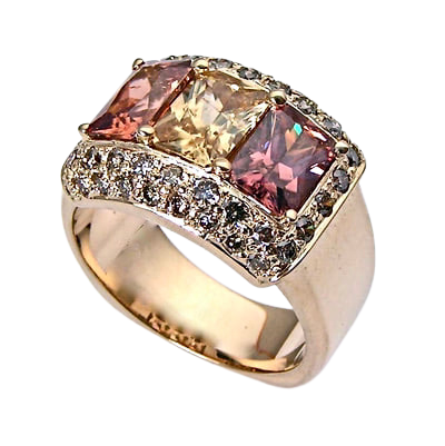 14 Karat Yellow Gold Ring with three rectangular Zircons and Champagne Diamond surrounding them.