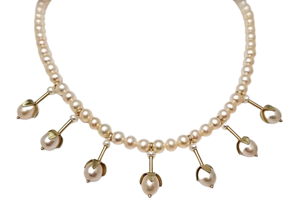 14 Karat Yellow Gold and 14 Karat Green Gold Pearl strand with 7 stations of one pearl with petal caps spaced around the bottom of the necklace.