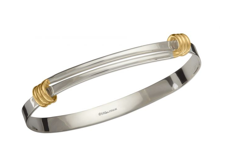 Sterling Silver bangle bracelet with two 14 Karat Gold wraps.