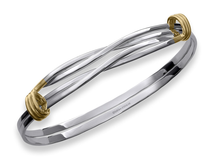 Sterling Silver bangle bracelet with two 14 Karat Yellow Gold double twisted lines and a triple row wrapped on each side of the top.