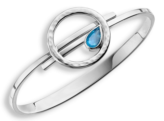 Sterling Silver bangle bracelet with a pear shaped Blue Topaz surrounded by an open circle of silver on the top.