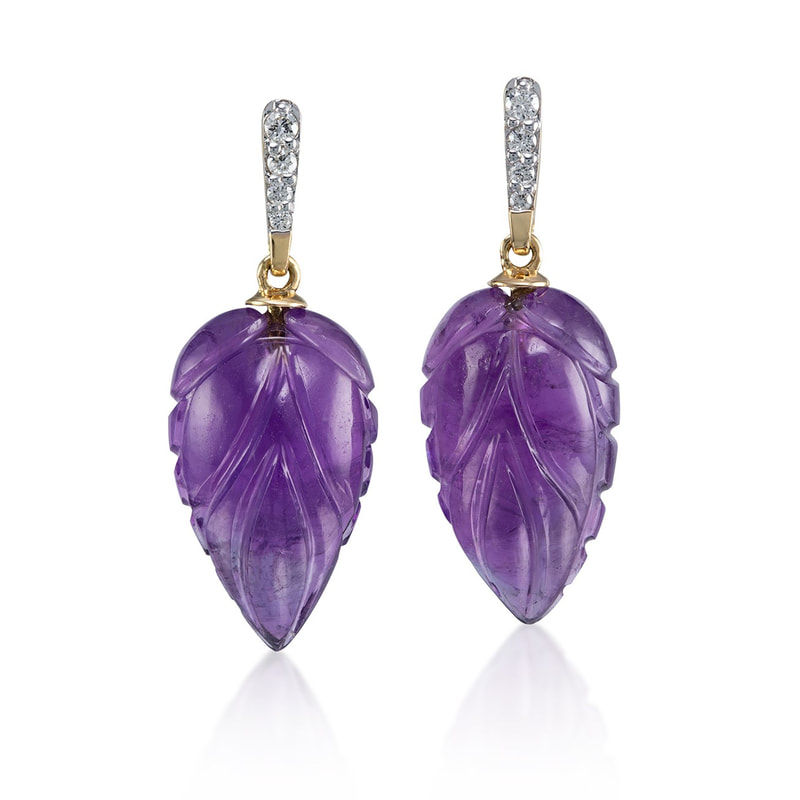 18 Karat Yellow Gold  post earrings with diamonds on the top and carved pear shaped Amethysts.