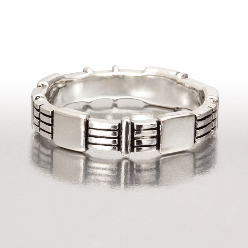 Platinum Sterling Silver 5mm band with notched designs all the way around.