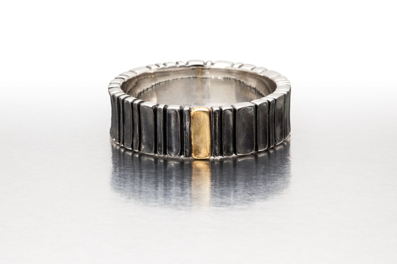 Blackened Sterling Silver Ring  with an accent of 18 Karat Yellow gold.