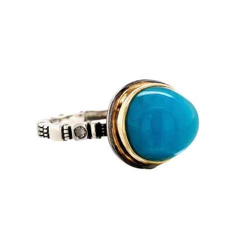 Platinum Silver ring with one cabochon Chrysocolla stone bezel set in 18KY and a diamond on each side on the band.