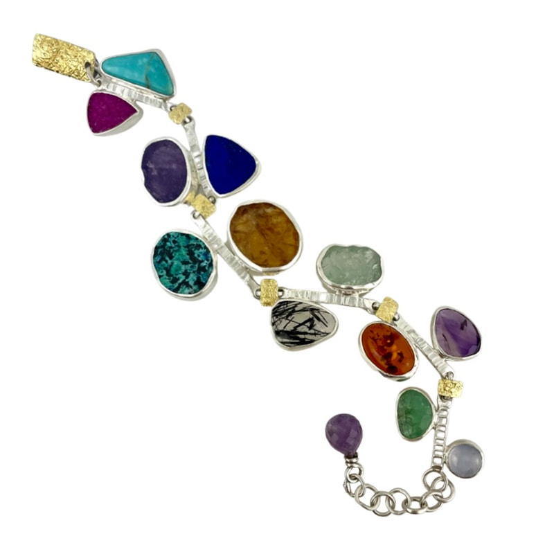 Gold and Silver Bi-Metal bracelet with multi-colored and shaped stones.