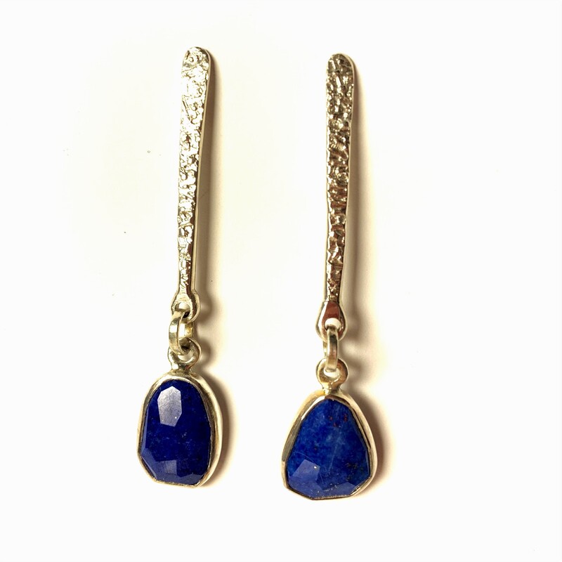 Sterling Silver 13x8mm Lapis dangles from textured silver pieces with french wire earrings.