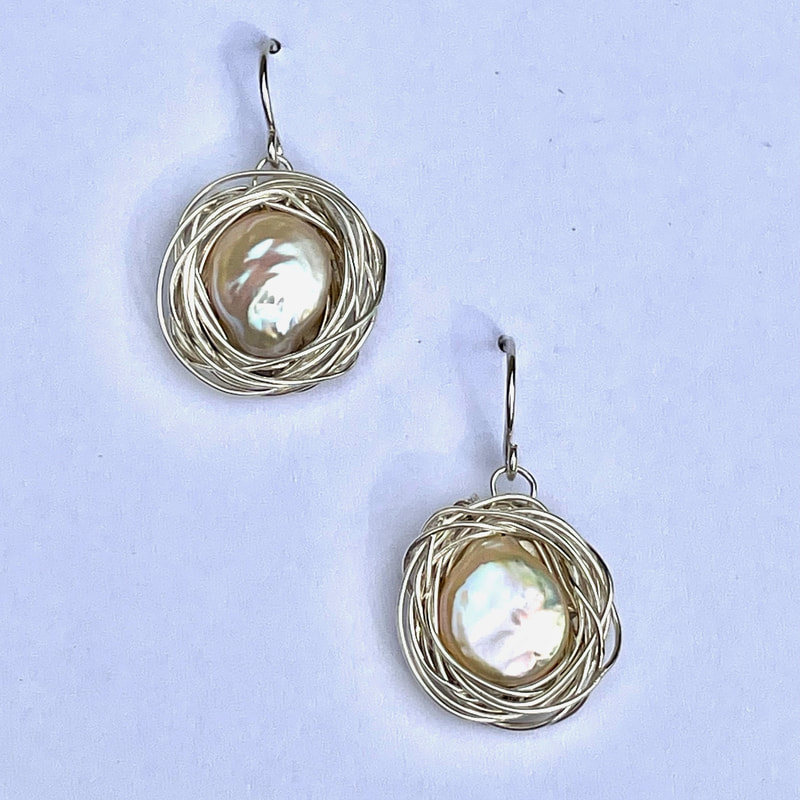 Sterling Silver French Wire "Nest" Earrings with coin pearls in the center and wire encircling them,