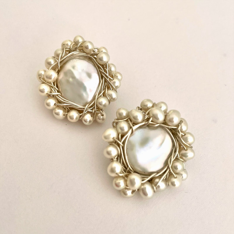 Sterling Silver Clip-On Earrings with a Coin Pearl surrounded  Fresh Water Potato Pearls.