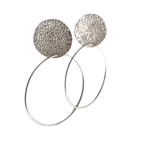 Sterling Silver Clip-on earring with a textured round shape station on the top with a hoop on the bottom.