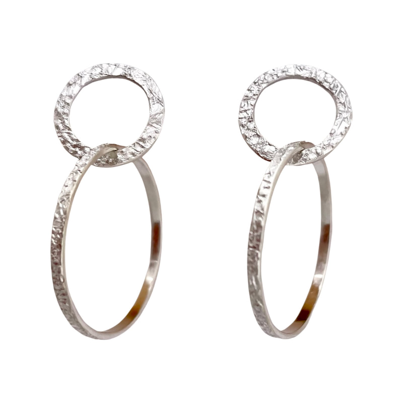 Sterling Silver textured earrings with a circle and a hoop attached.