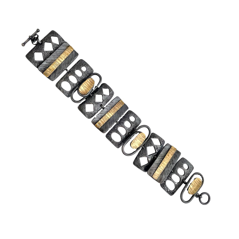 22 Karat Yellow Gold & Sterling Silver Bi-Metal link bracelet.