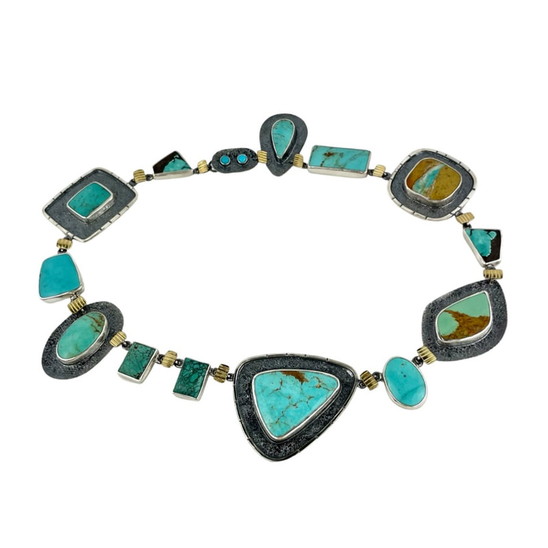 22KY & Sterling Bi-Metal necklace with different shapes of Turquoise all around it.