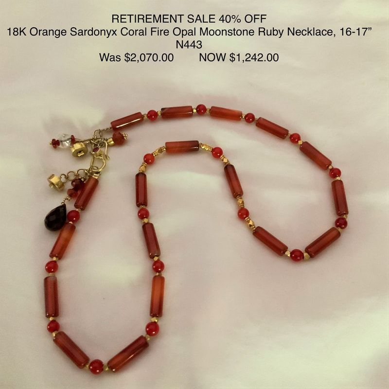 18 Karat Yellow gold necklace with elongated Red Coral beads alternating with gold beads and round Sardonyx beads and dangling gemstones at the clasp.