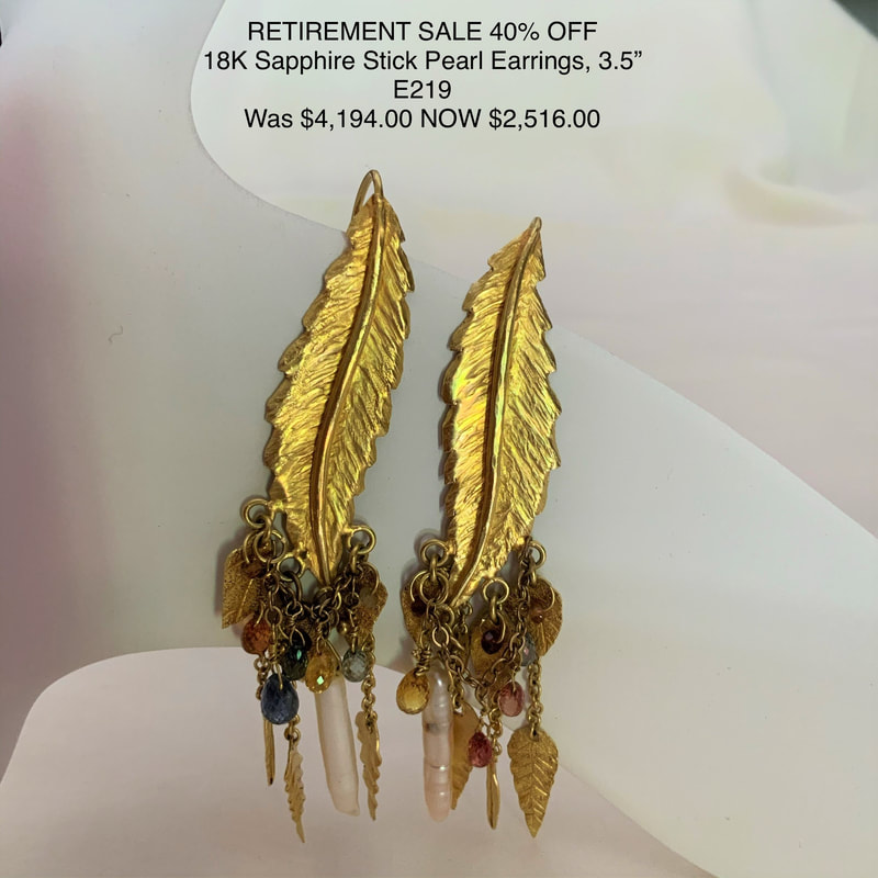18 Karat Yellow gold earrings with long gold carved leaves with dangling multi-color Sapphires and Pearl beads.