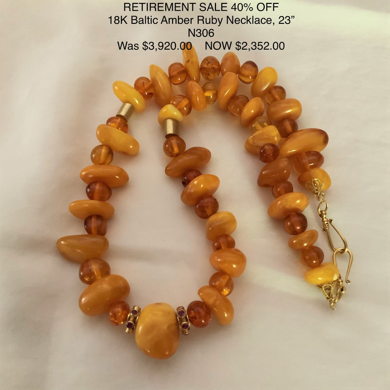 18 Karat Yellow Gold Necklace with different shaped Amber and small gold beads.