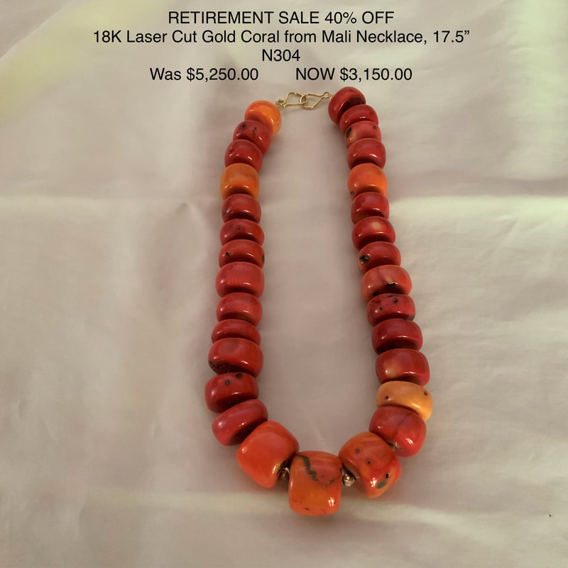 18 Karat Yellow Gold Necklace with large barrel shaped Coral from Mali.