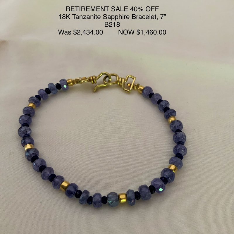18 Karat Yellow Gold bracelet with Tanzanite and Blue Sapphire beads.