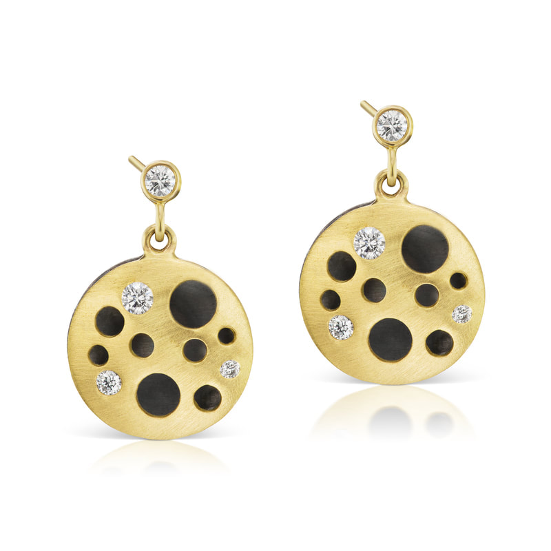 18 Karat Yellow Gold post earrings with open circles and flush set diamonds with oxidized background.