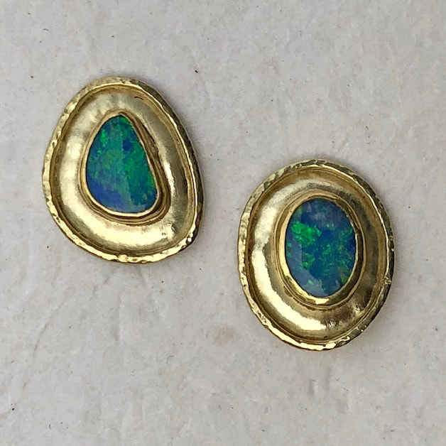 High Karat Yellow Gold post earrings with Australian Opal doublets with frames of gold around them.