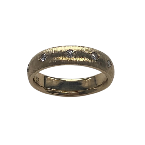 Yellow gold domed, textured band with spaced inset diamonds all the way around.