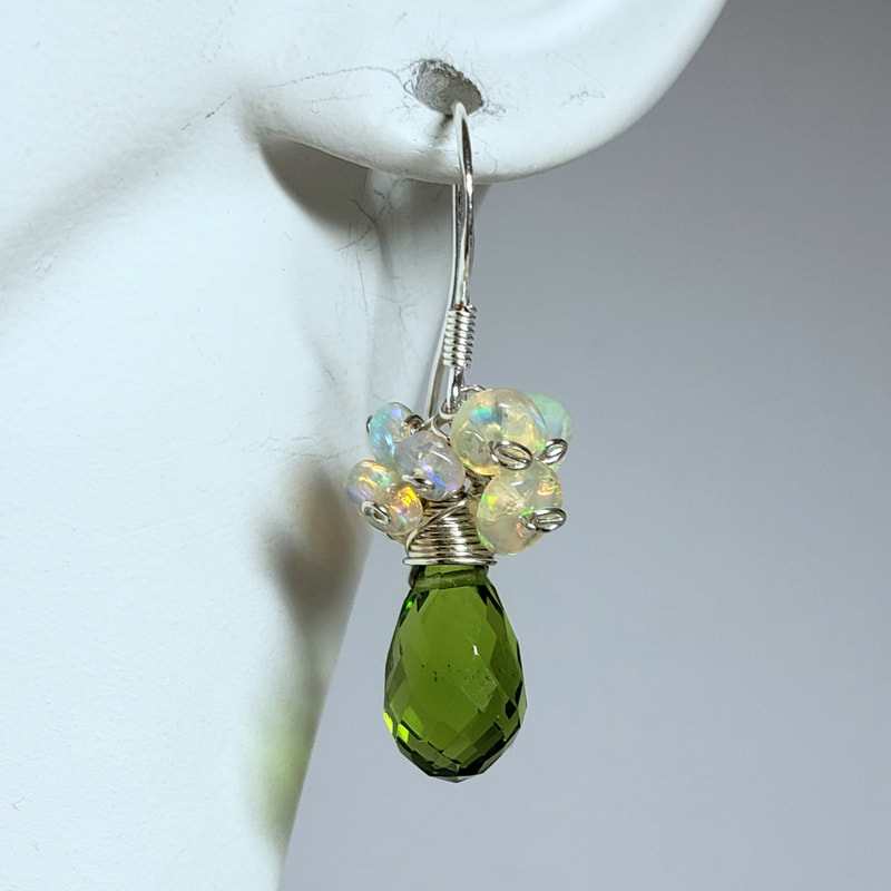 Sterling Silver French Wire earrings with a Faceted briolette Peridot and a cluster of small opals surrounding it at the top.