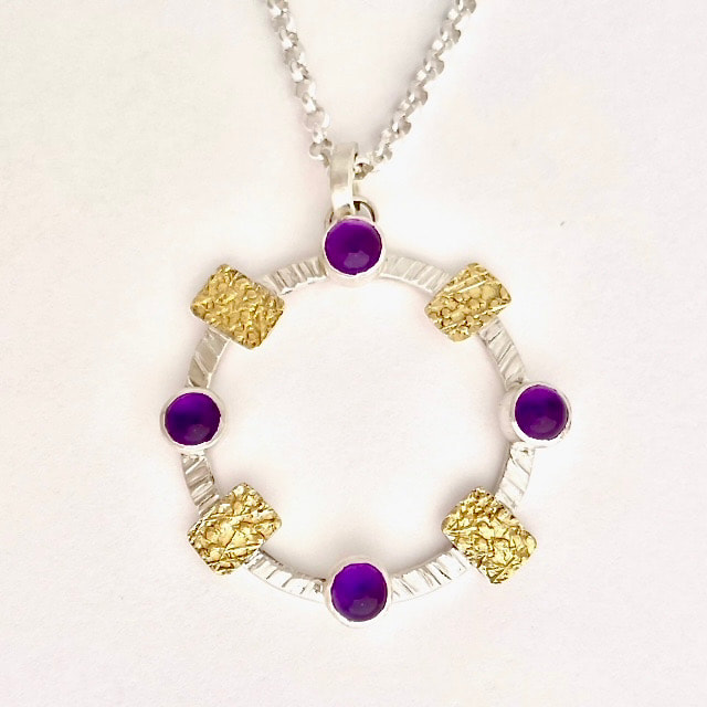 22KY & Sterling Silver Circle Pendant with Amethysts and stations of gold.