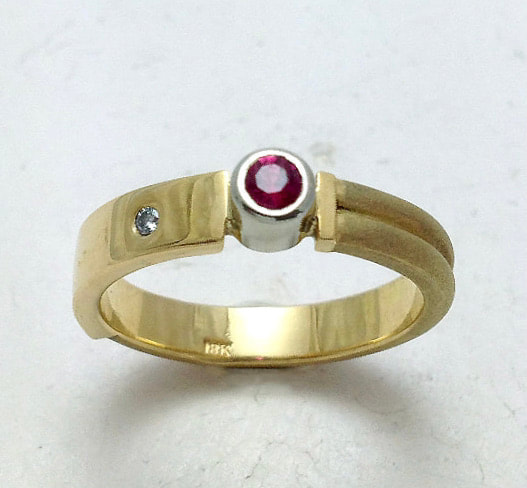 18 Karat Yellow & 18 Karat White Gold 4mm ring with a Ruby & Diamond.