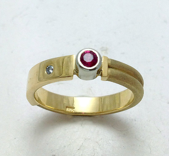 18 Karat Yellow & 18 Karat White Gold 4mm ring with a Ruby & Diamond.