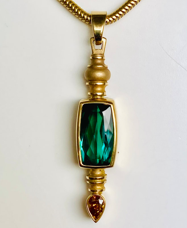  18 Karat Yellow Gold Pendant with one rectangular shaped Green Tourmaline & Orange Diamond. 