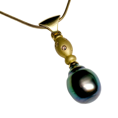 18 Karat Yellow Gold Pendant with one Cultured South Sea Pearl & scattered diamonds.