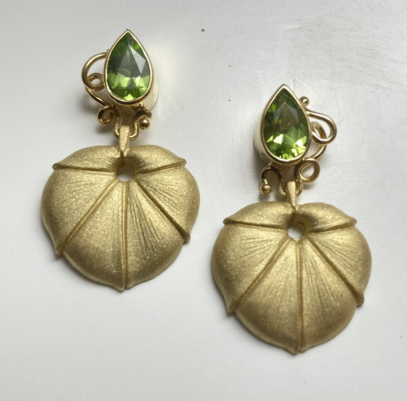 18 Karat Yellow Gold Earrings with Pear Shaped Natural Peridot "Leaf" Post Earrings.