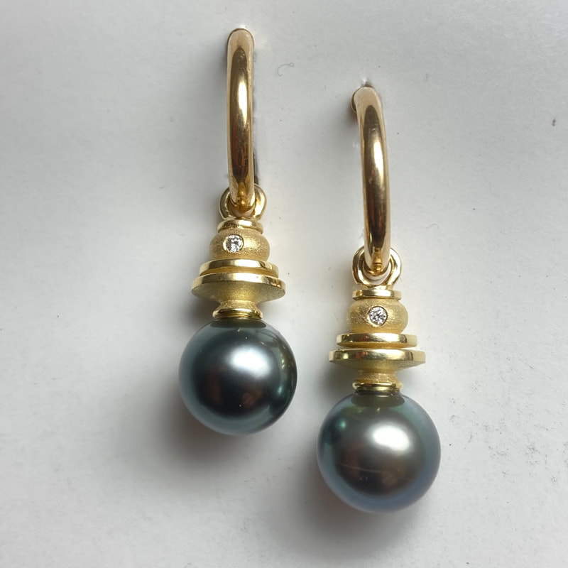 18 Karat Yellow Gold Earrings with 9mm Cultured South Sea Pearls & Diamonds.