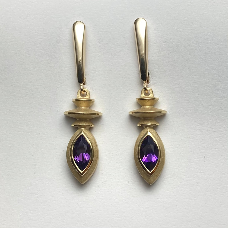 18 Karat Yellow Gold Earrings with Marquise Shaped Natural Amethyst. 