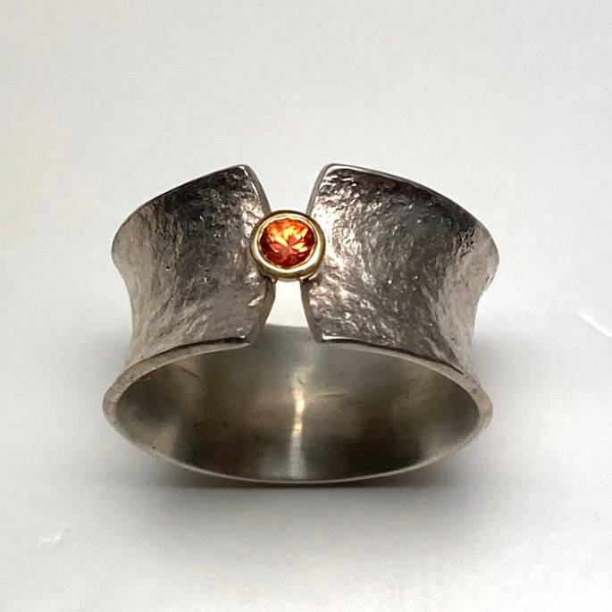 18 Karat Yellow Gold & Oxidized Sterling Silver 10mm wide ring with a Tangerine Sapphire.