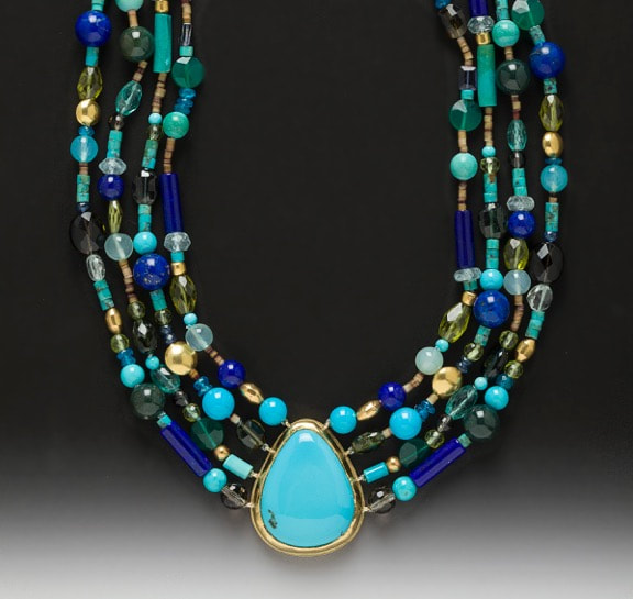 22 Karat & 18 Karat Yellow Gold 4 strand beaded necklace with a pear shaped bezel set Turquoise in the center.
