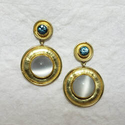 22 Karat Yellow Gold & 18 Karat Yellow Gold post earrings with a round Blue Zircon and a larger round Moonstone below it.