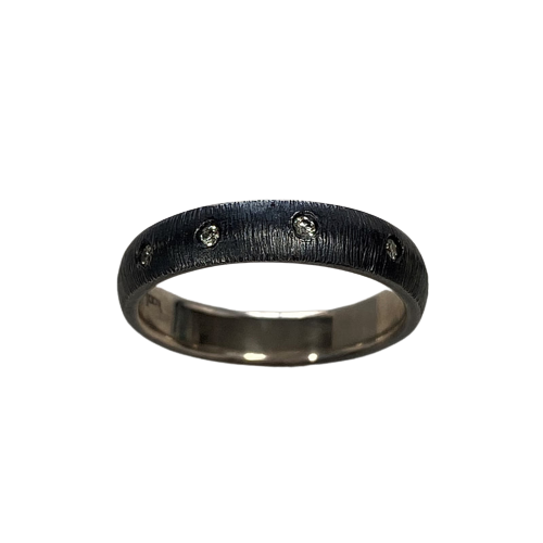 Oxidized Sterling Silver domed, textured band with spaced inset diamonds all the way around.