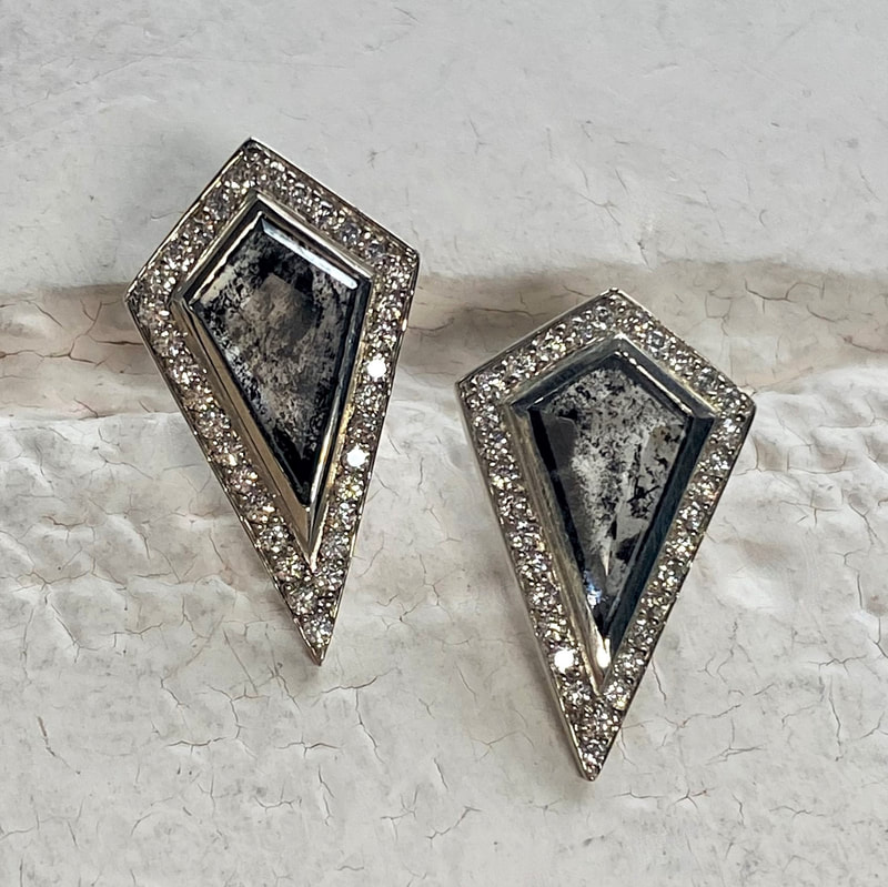 White gold kite shaped earrings natural gray diamonds traced by smaller white diamonds with post backs.