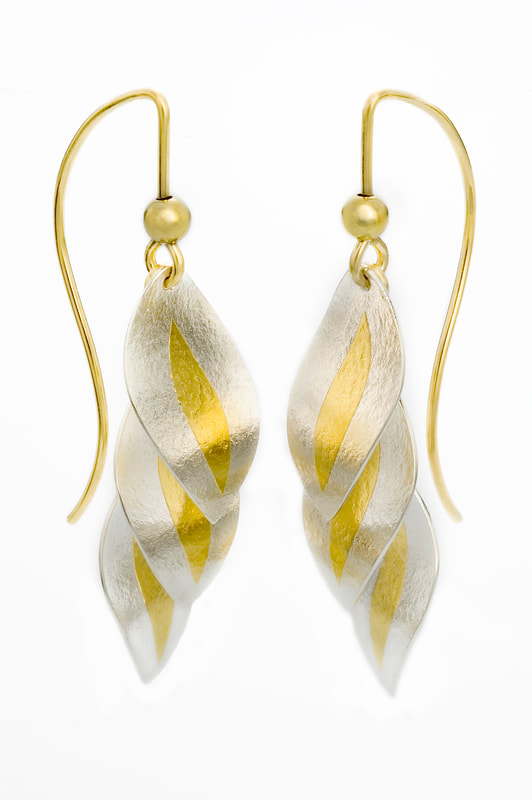 24 Karat Yellow Gold overlay layers of leaf shapes and 18 Karat Yellow Gold French Wires.