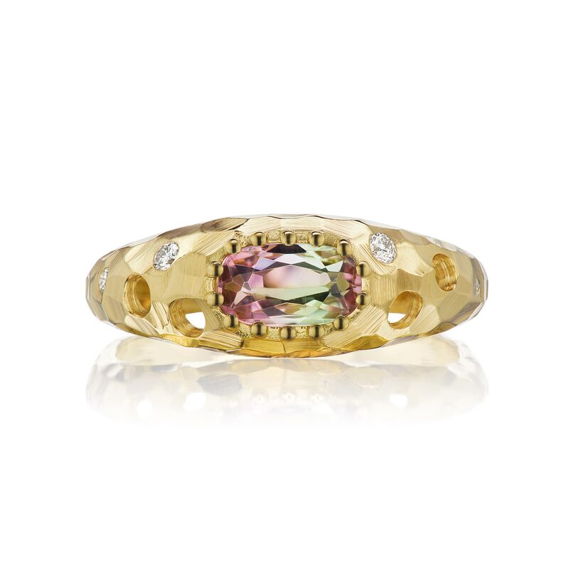 18 Karat Yellow Gold ring with an oval Watermelon Tourmaline in the center, open circles and flush set diamonds down the sides.
